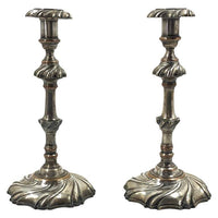 Pair of Georgian silvered candlesticks, full view.