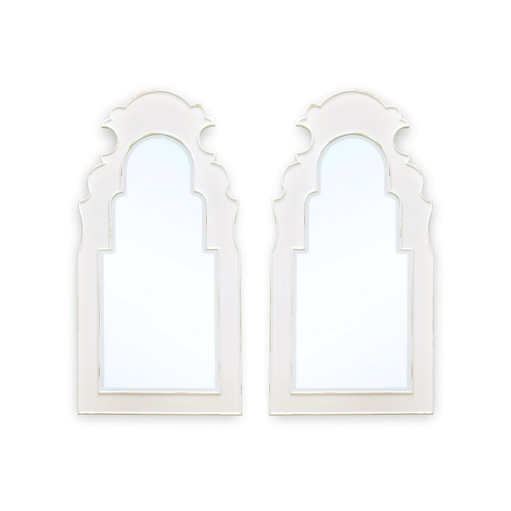 White wall mirrors, ornate design, side by side.