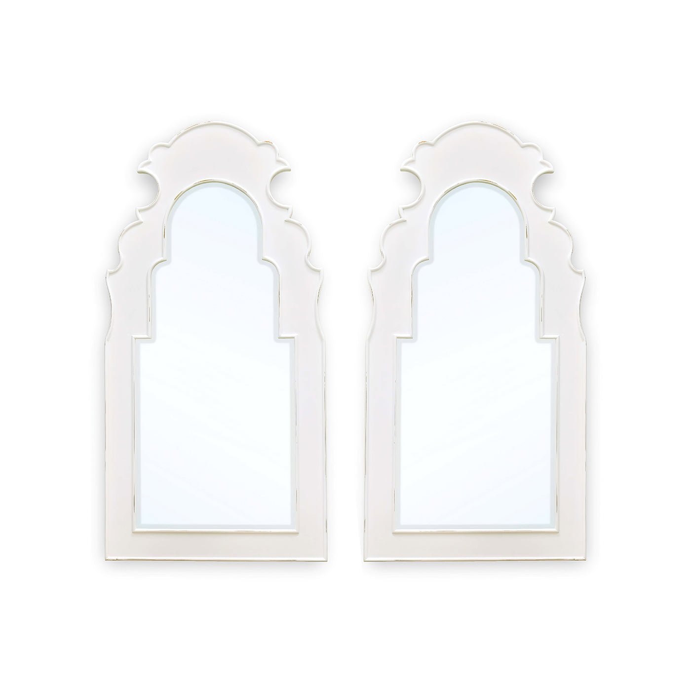White wall mirrors, ornate design, side by side.