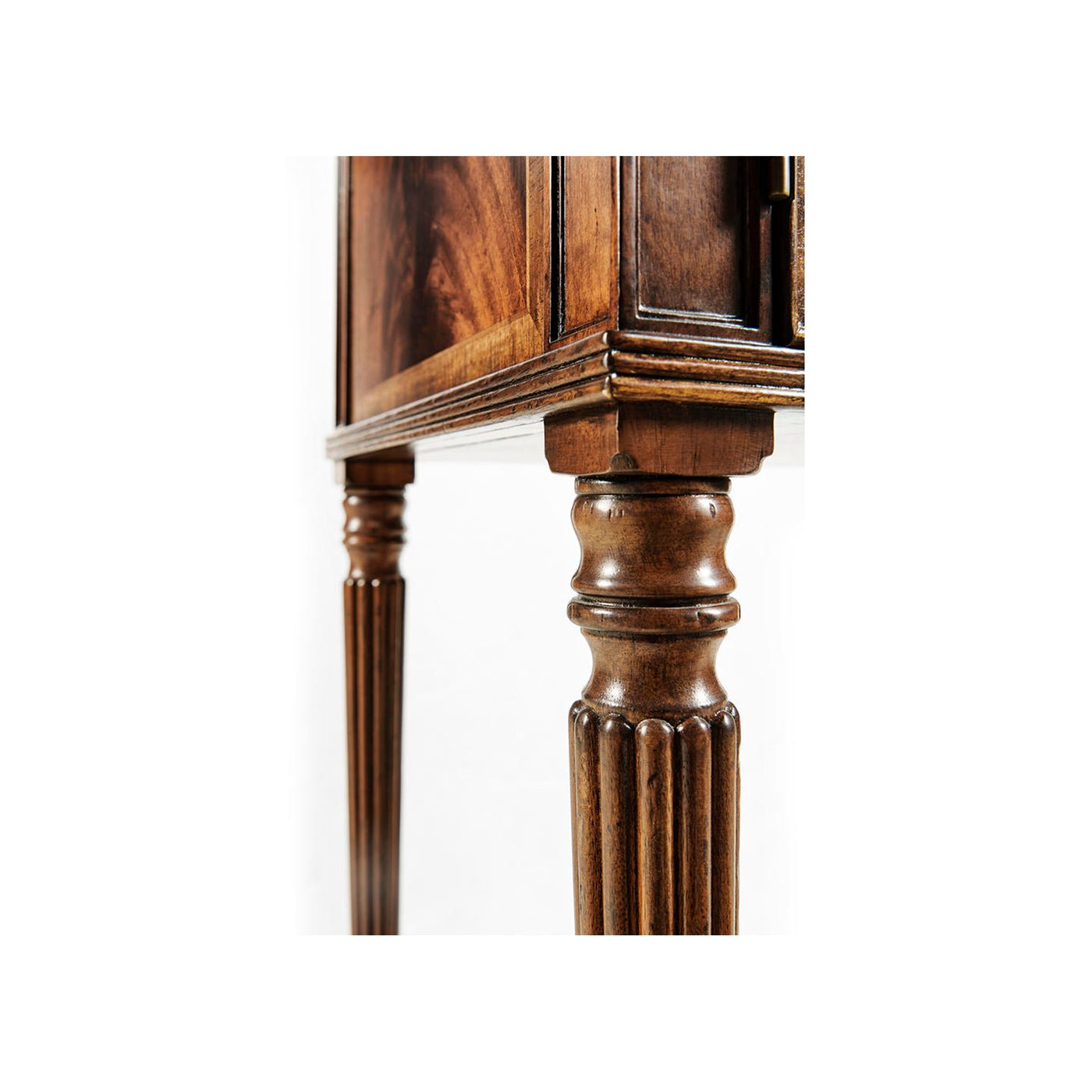 Leg detail of mahogany bedside cabinet.