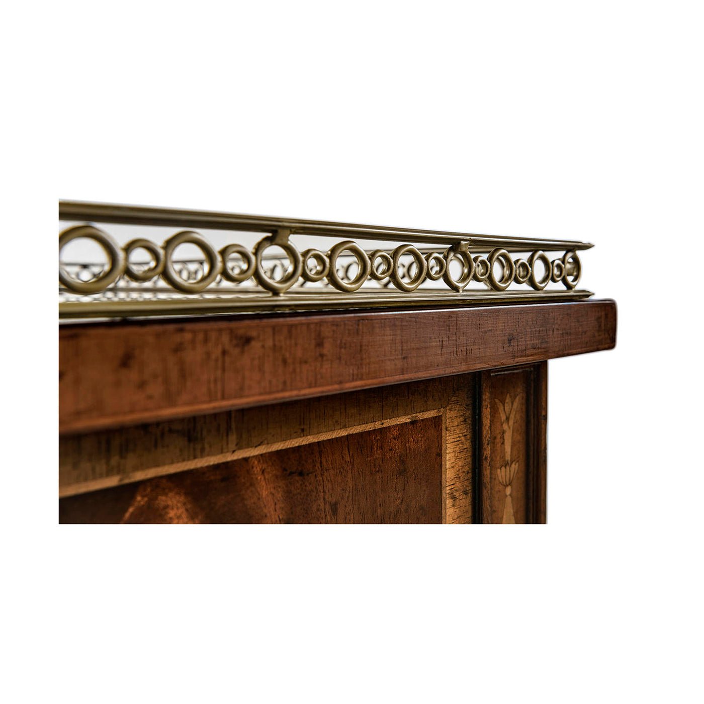 Mahogany bedside cabinet decorative metal railing detail.