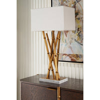 Single lamp on dark wood cabinet, artistic backdrop.
