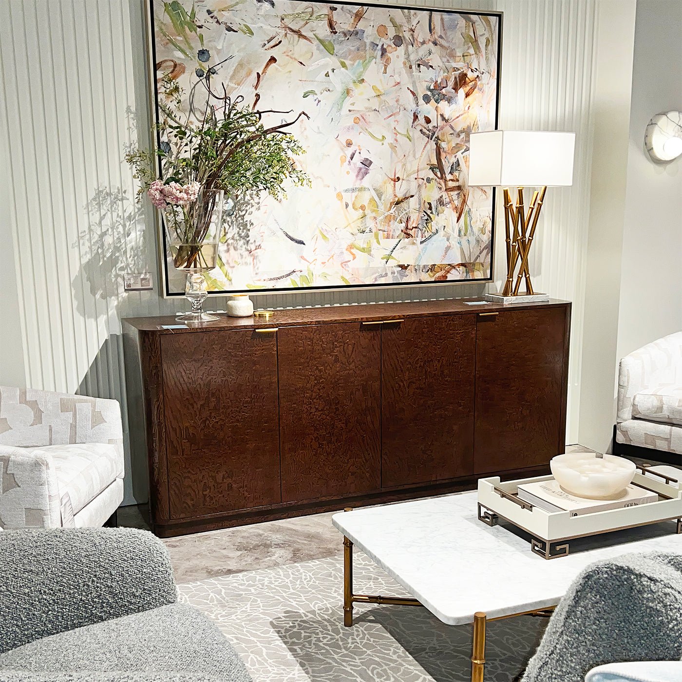 Living room with mid-century table lamp on cabinet.