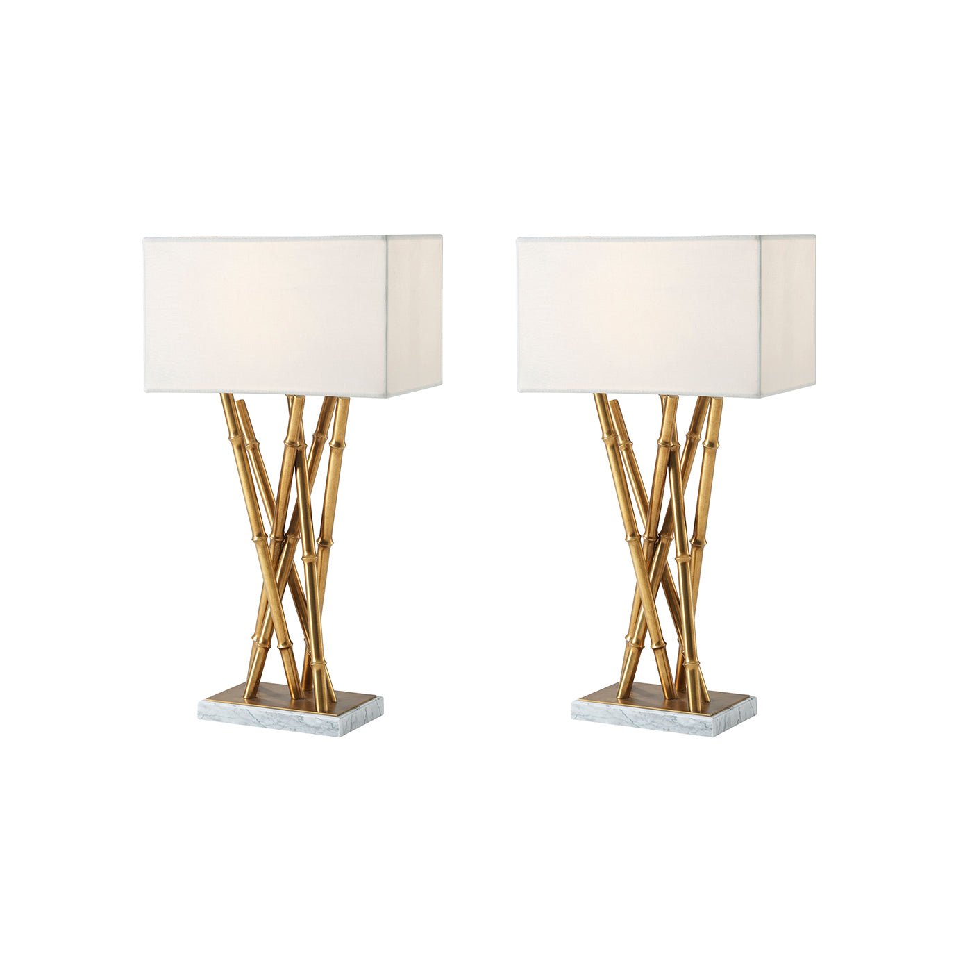 Pair of brass table lamps with white shades.