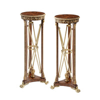Two regency style pedestals with ornate design.