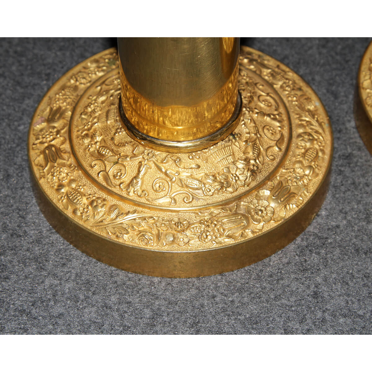 Detailed view of ornate base on Neo Classic candlestick.