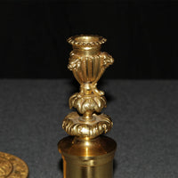 Close-up of ornate top section of candlestick.