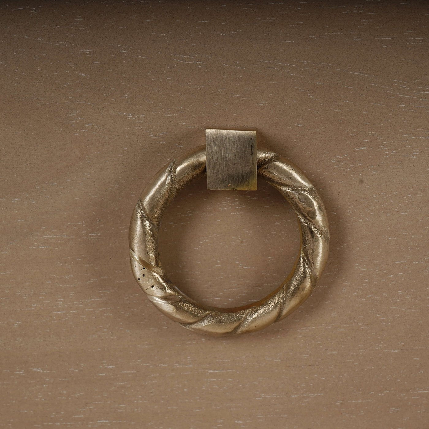 Close-up of nightstand's ring handle.
