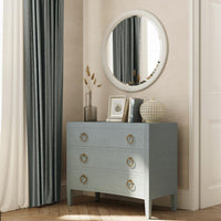 Chest of drawers in stylish bedroom setting.