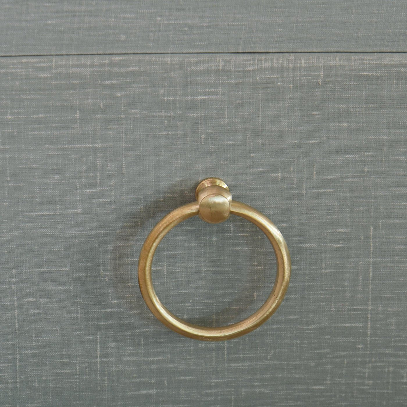Close-up of gold handle on dresser.