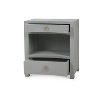 Open drawers pale blue linen nightstand.