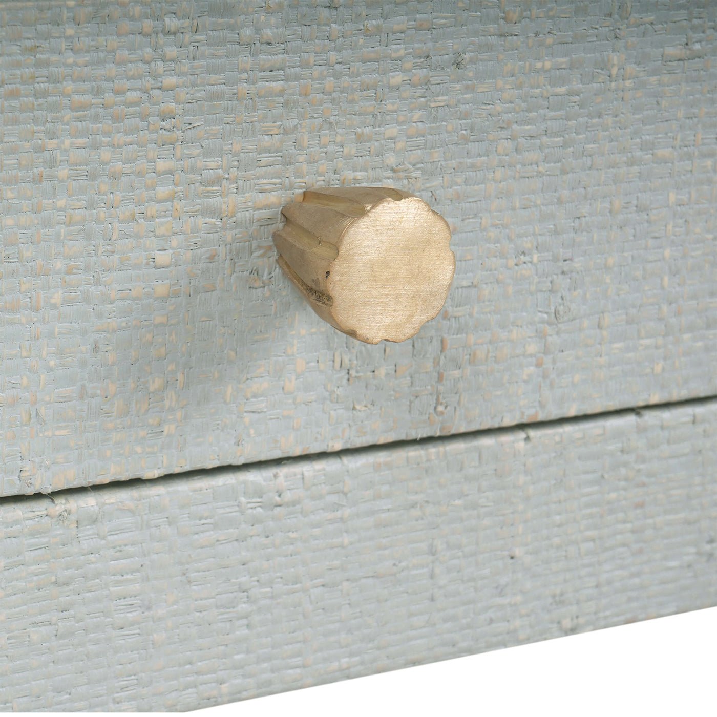 Close-up of drawer knob, pale blue bedside table.