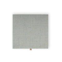 Top view of bedside table, pale blue surface.