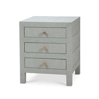 Pale blue bedside table, angled view, three drawers.