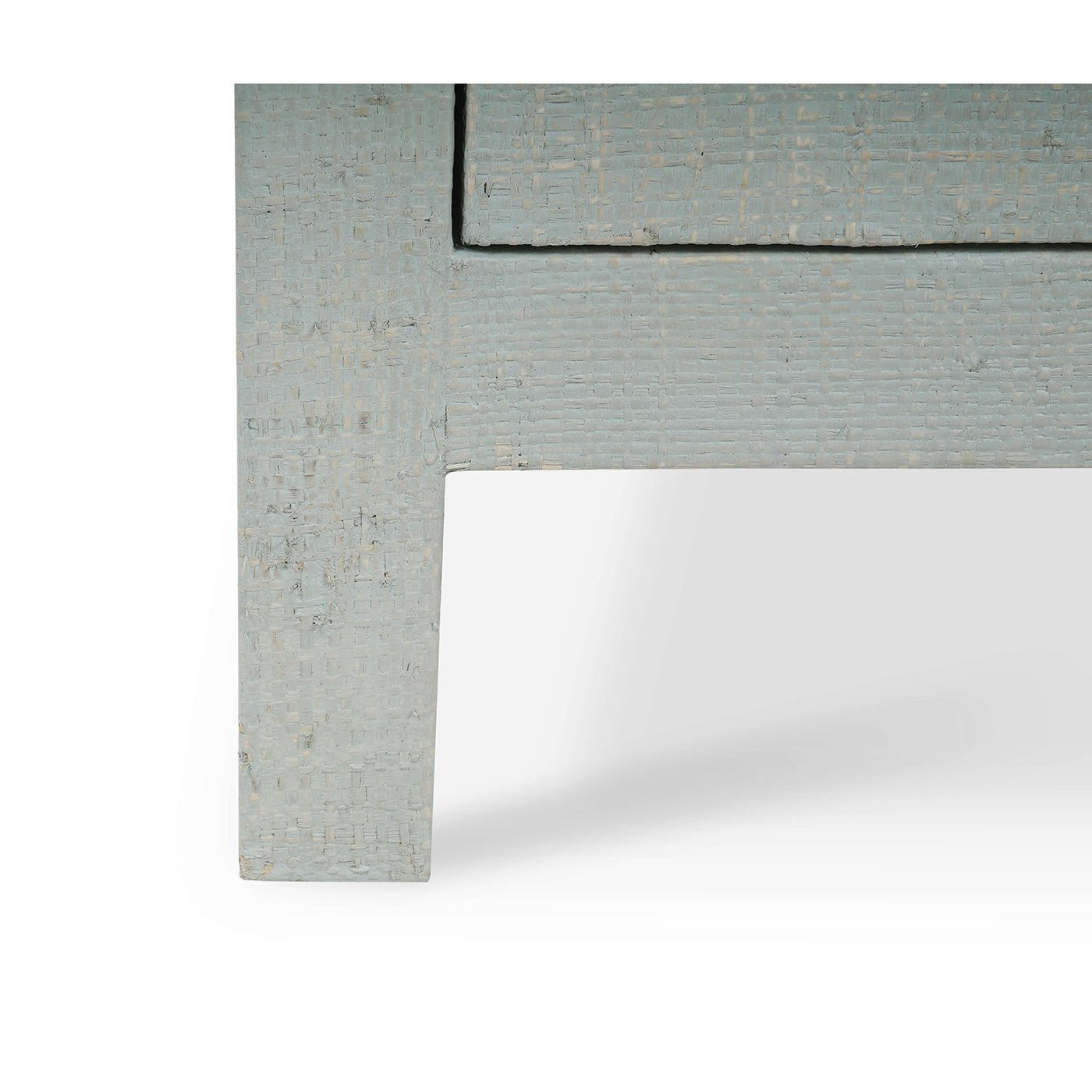 Leg detail of pale blue bedside table, textured finish.