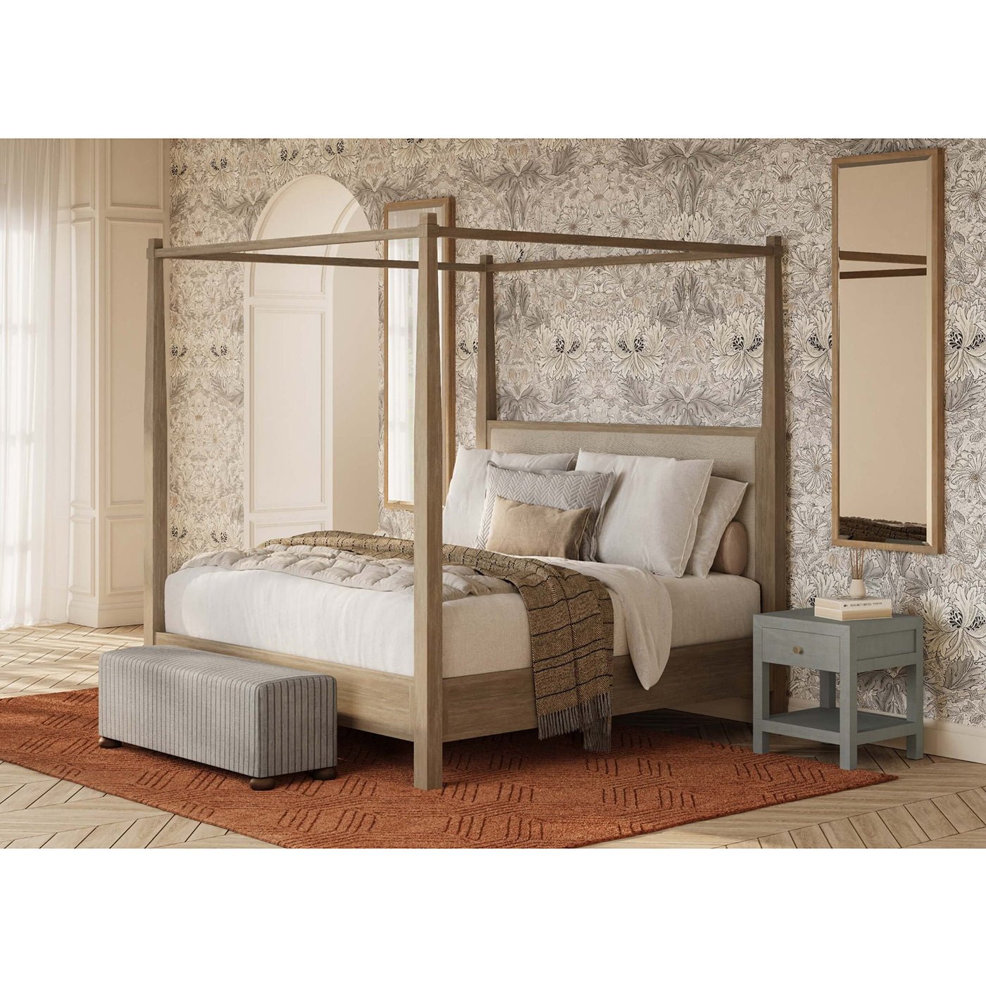 Bedroom setting with nightstand beside canopy bed.