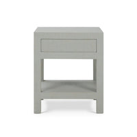 Side view of pale blue raffia nightstand.