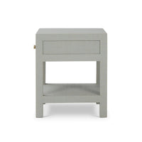 Back view of pale blue raffia nightstand.