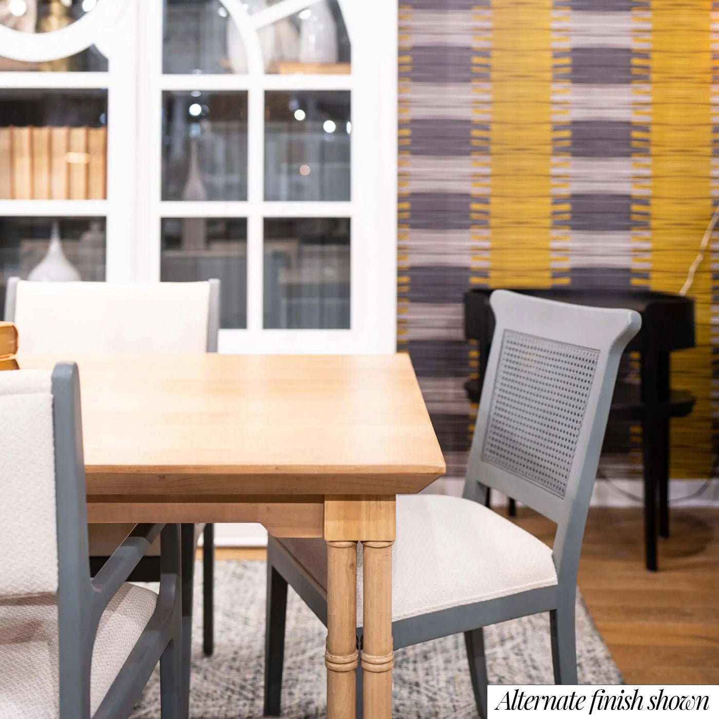 Dining table close-up with chairs, alternate finish.