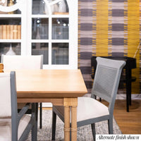 Dining table close-up with chairs, alternate finish.