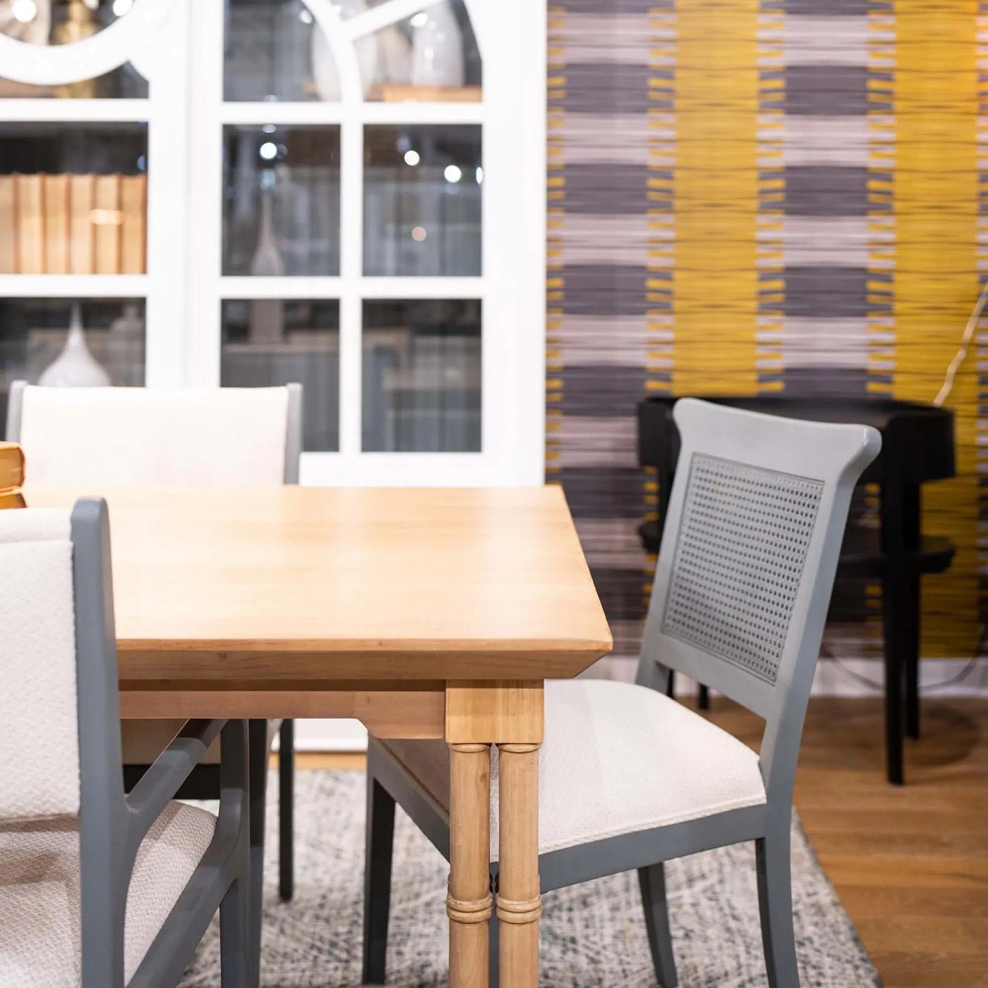 Partial view of Palm Beach Regency dining table with chairs.