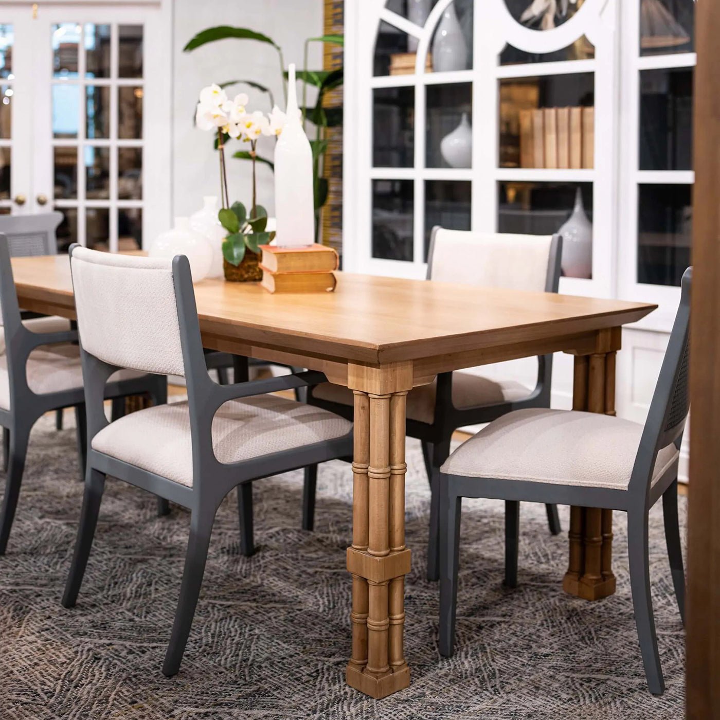 Close-up of Palm Beach Regency table with surrounding chairs.