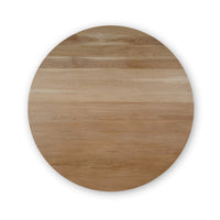 Top view of round wooden dining table surface.