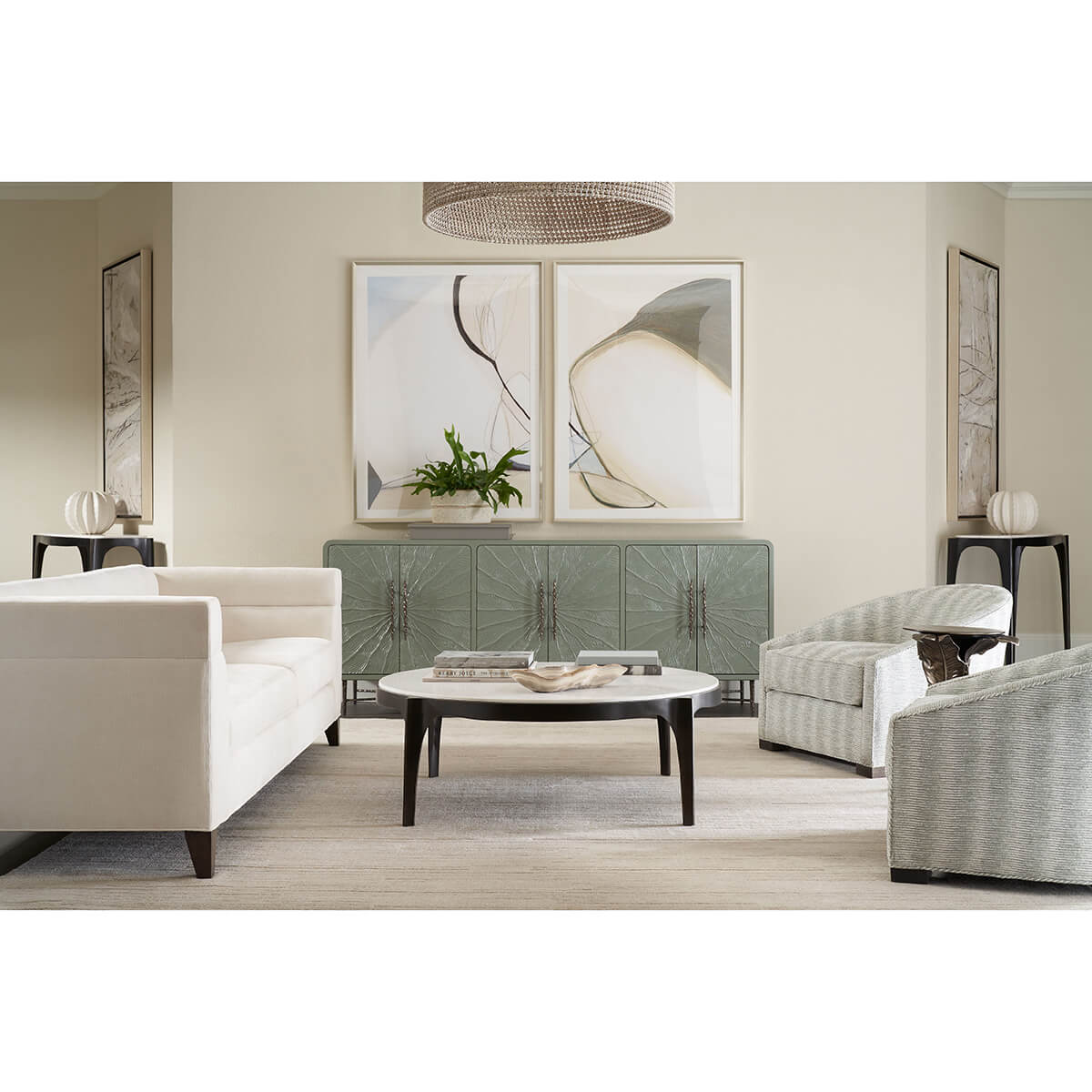 Living room featuring elegant leaf-accented accent table.
