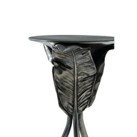 Close-up of leaf design on accent table.