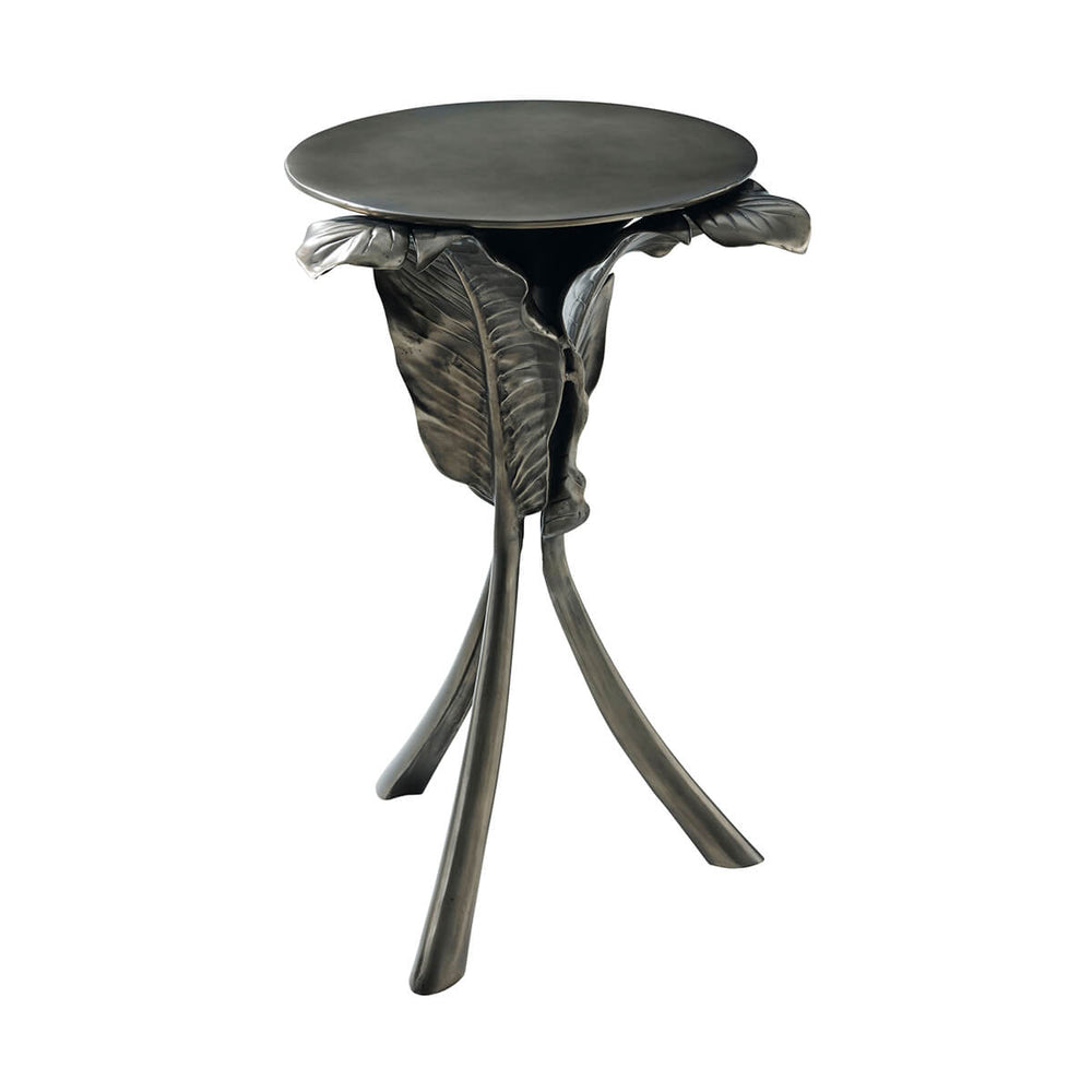 Artistic leaf-themed accent table with tripod legs.