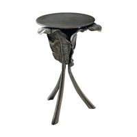 Artistic leaf-themed accent table with tripod legs.