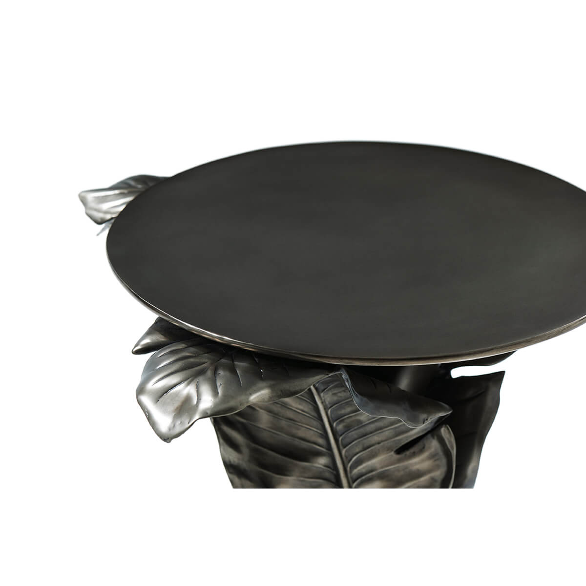 Top angle of round accent table with leaf motif.