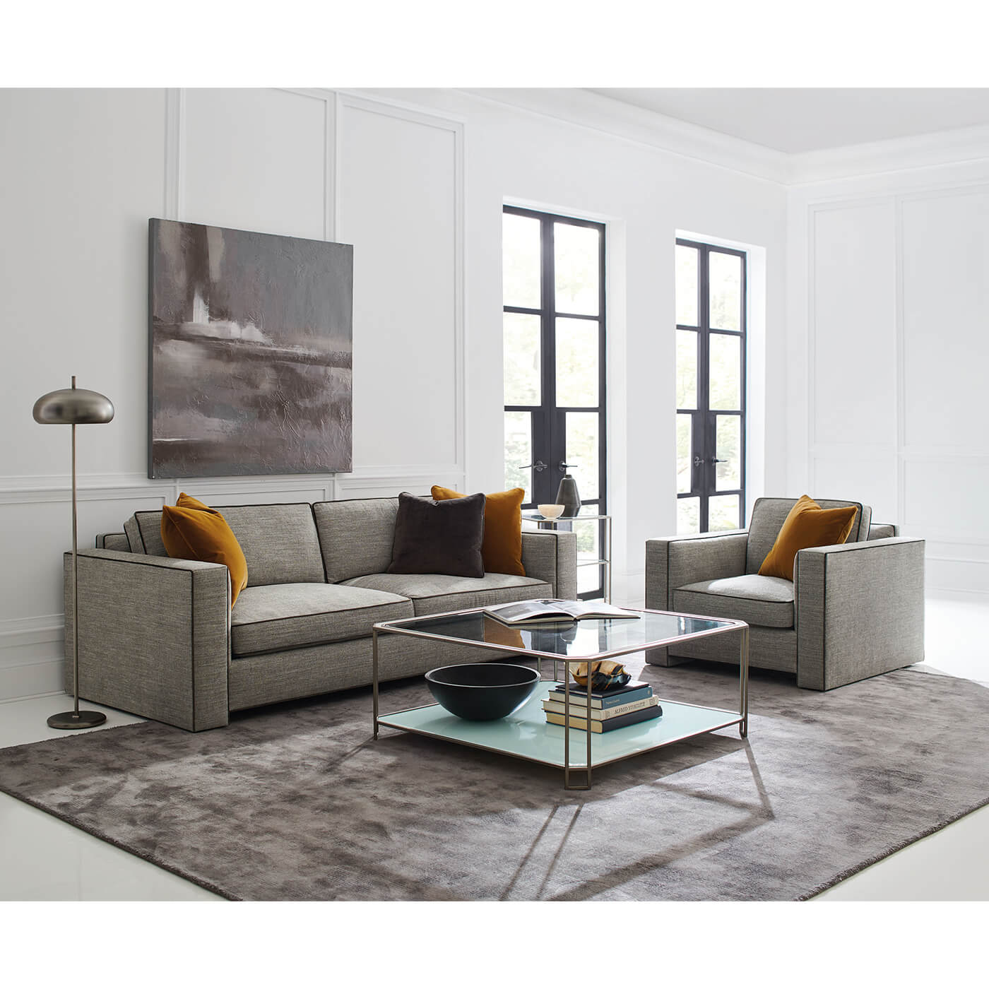 Gray sofa in stylish living room setting.
