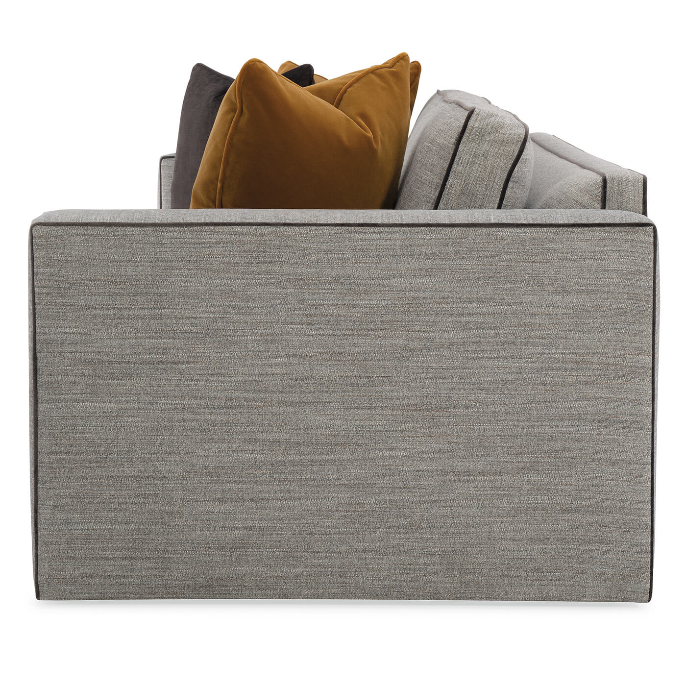 Side view of gray sofa with bold colored pillows.