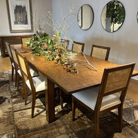 Dining room setup, extended Parsons table, chairs arranged.