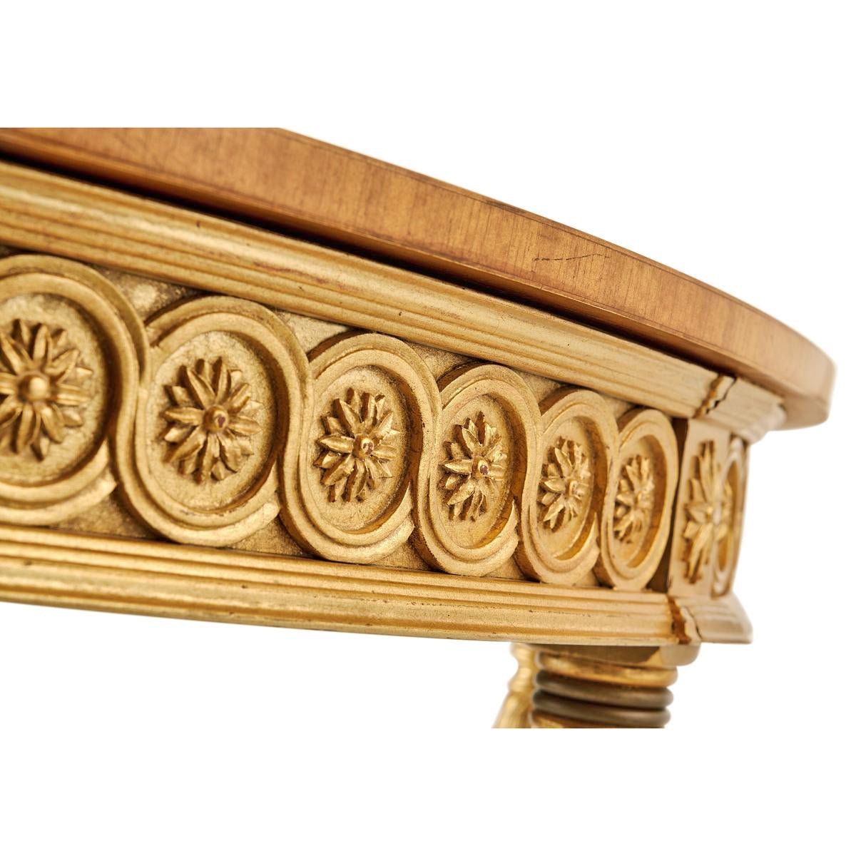 Detailed view of table's ornate giltwood carvings.