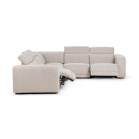 Angled view of gray sectional with headrests raised and a footrest extended to show the reclining mechanism