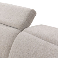 Close-up of gray sectional showing one raised headrest beside a lowered headrest