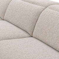 Close-up of gray sectional seat and back cushions with softly rounded edges