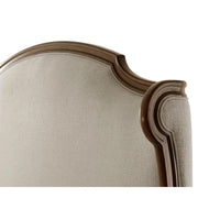 Detailed view of headboard corner, elegant curves.