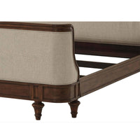 Close-up of bed leg and frame detailing, wooden finish.
