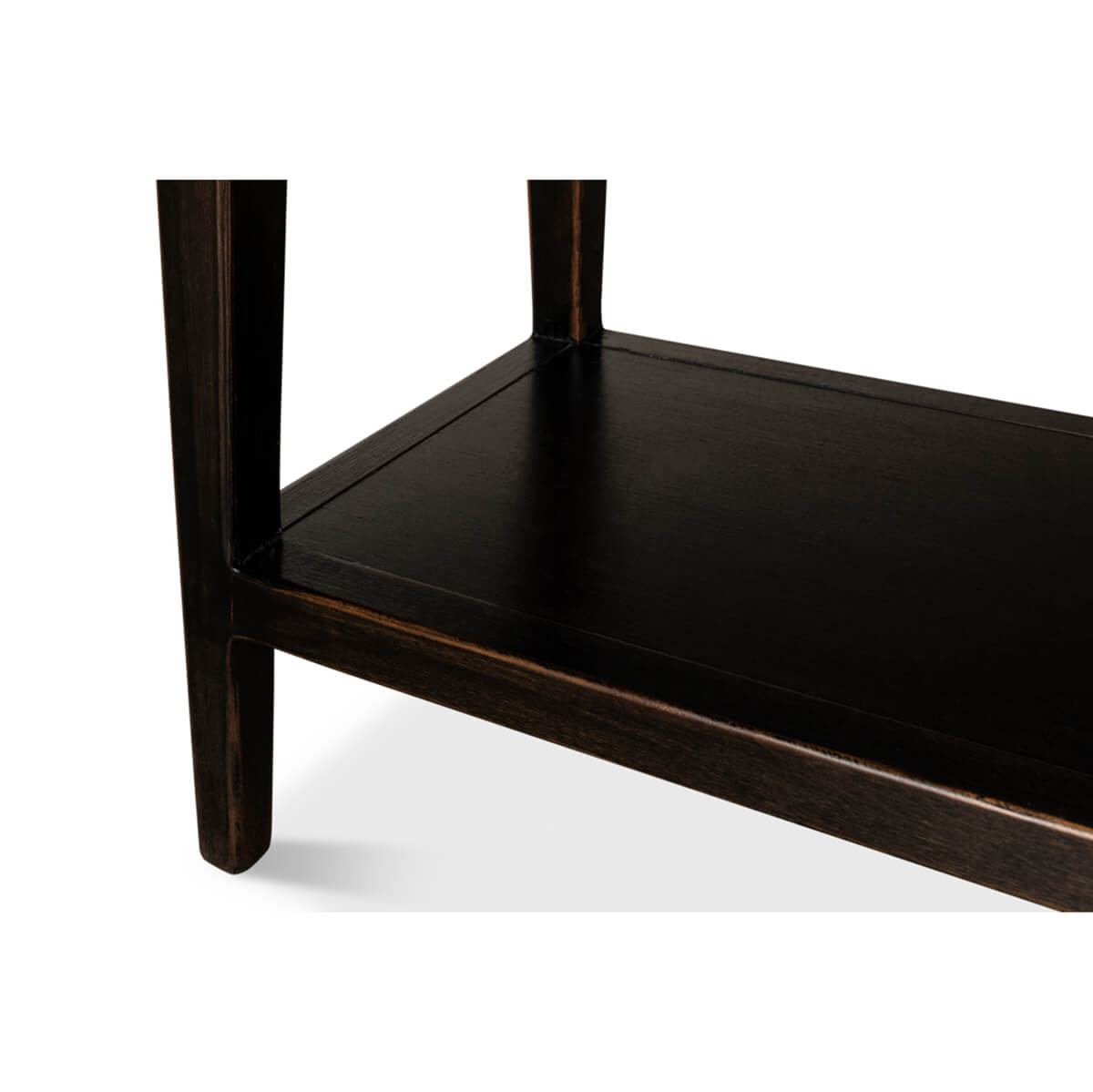 Lower shelf detail of ebonized display cabinet bookcase.