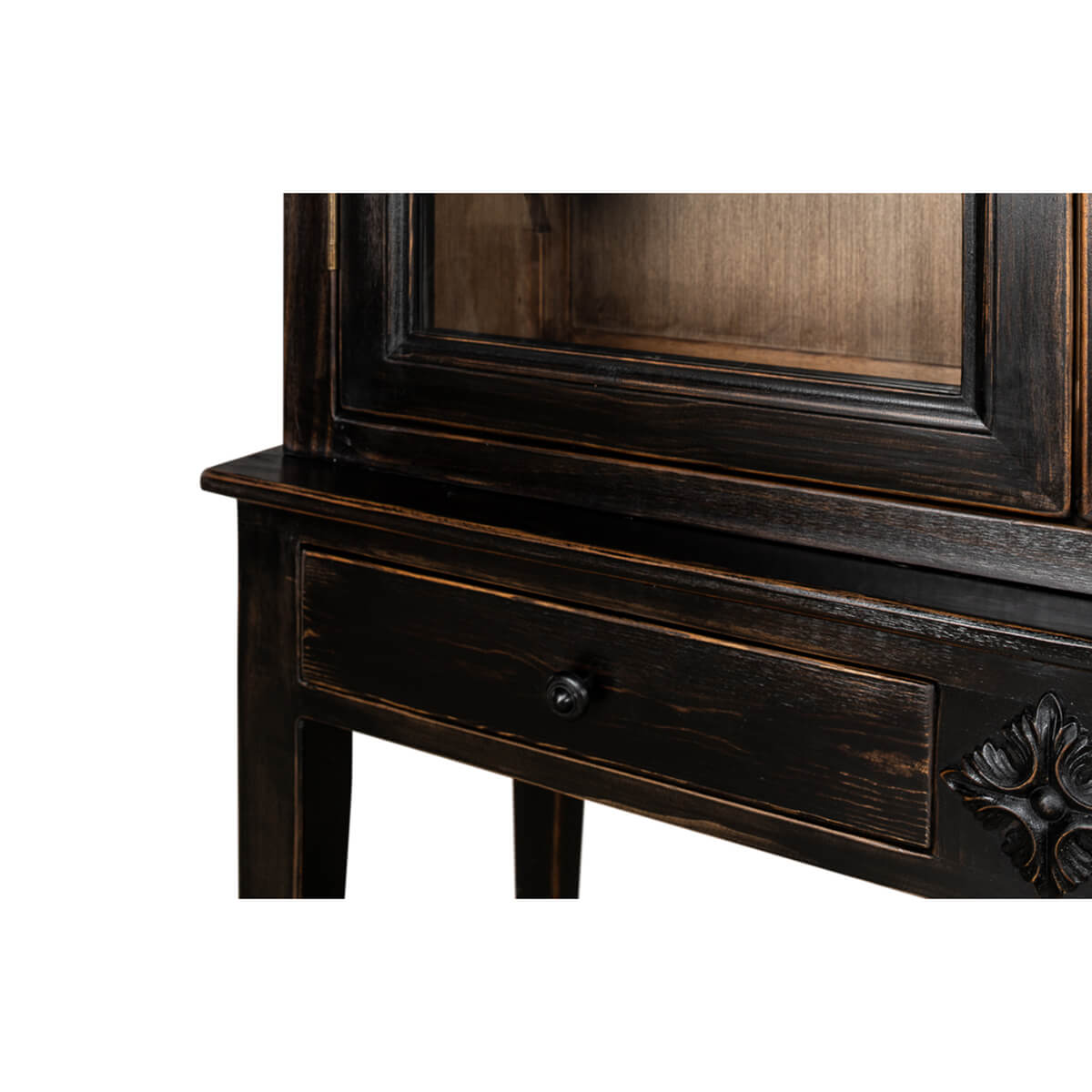 Close-up of ebonized display cabinet drawer and wood detail.