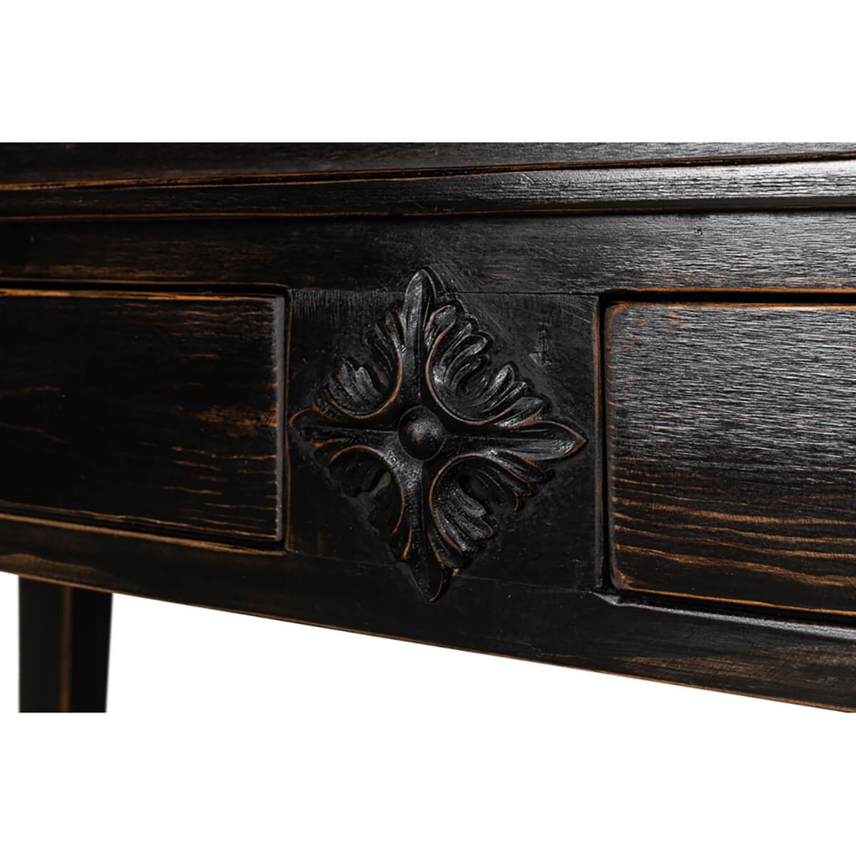 Close-up of carved motif on ebonized display cabinet.