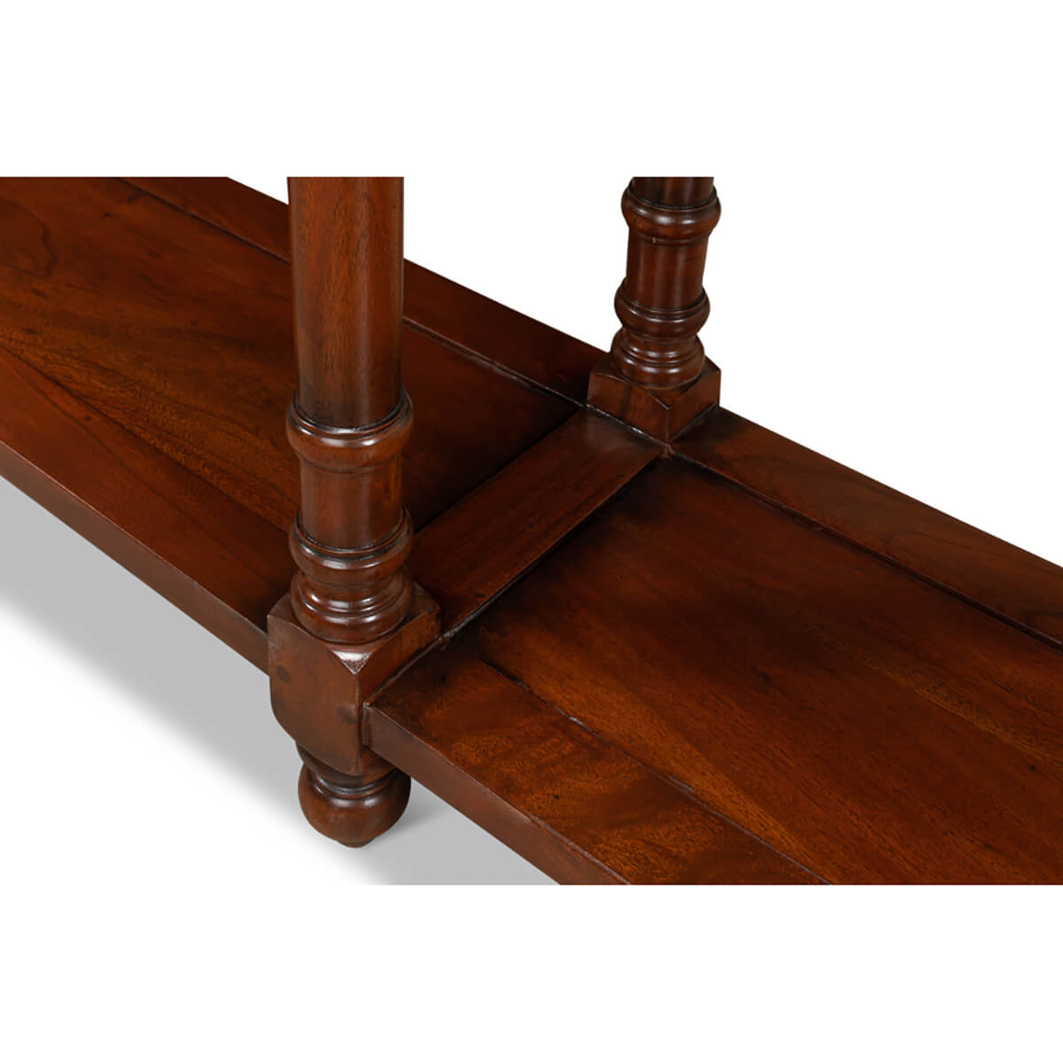 Detailed view of bottom shelf and legs on console.