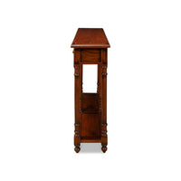 Side profile of wooden console table, detailed legs.