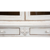 Close-up of decorative detail on cabinet front.