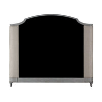 Headboard of king size bed with classic curve design.