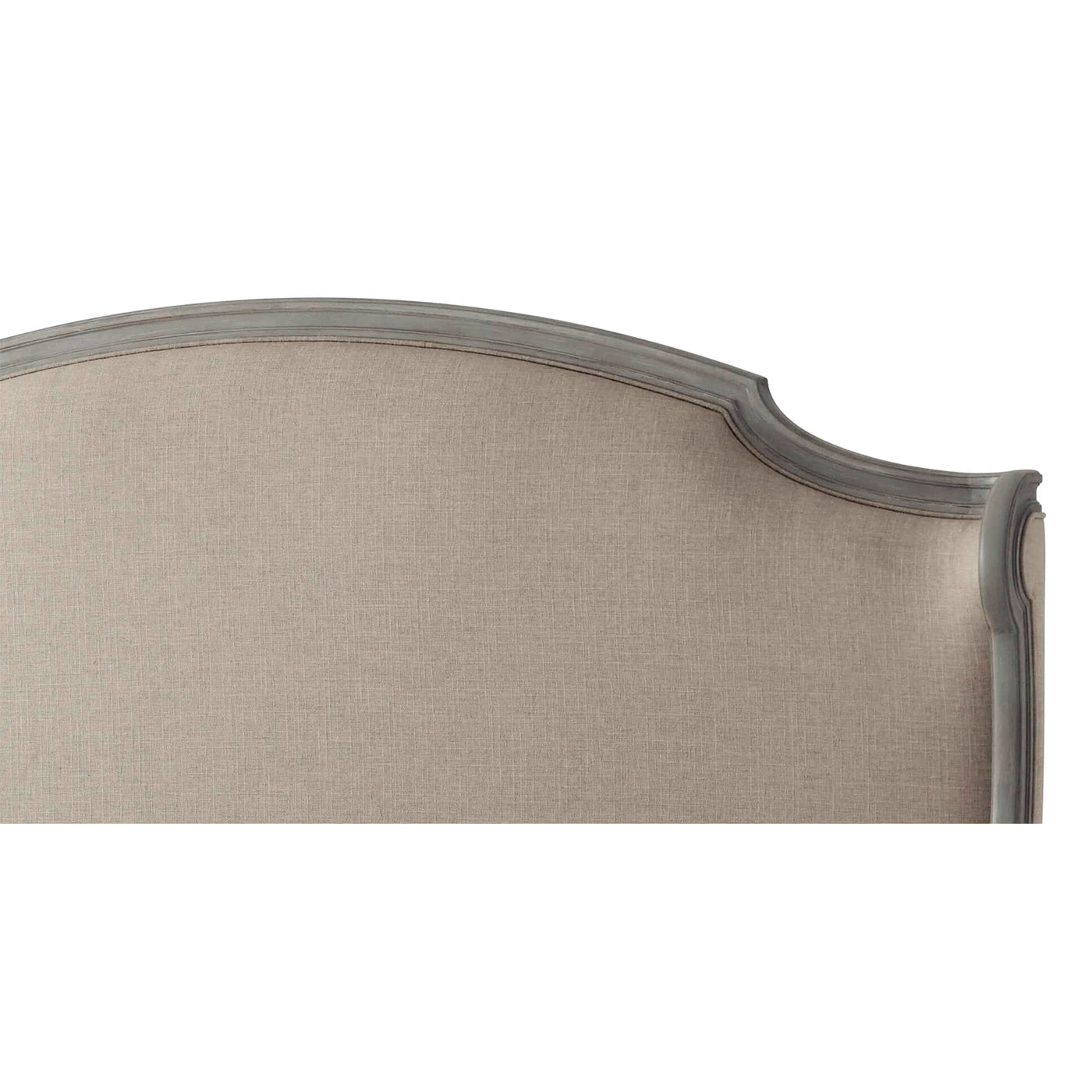 Close-up of headboard's detailed upholstery and frame.