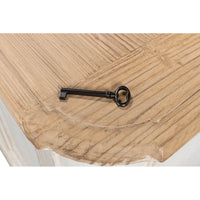 Antique key on wooden top of painted buffet.
